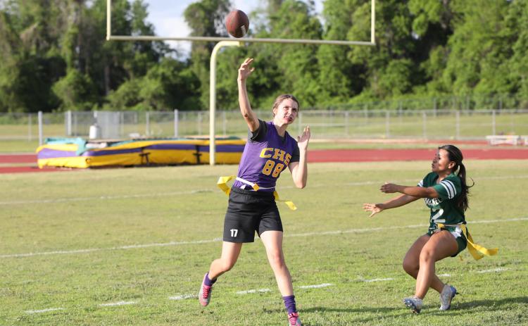 Columbia quarterback Mia Brasel rolls out to pass against Suwannee on Tuesday night. (BRENT KUYKENDALL/Lake City Reporter)