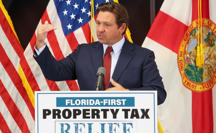 Gov. Ron DeSantis speaks about his proposal for Florida to become the first state to abolish property taxes during a news conference at the Florida Realtors headquarters in Orlando on Monday. (RICH POPE/Orlando Sentinel/TNS)