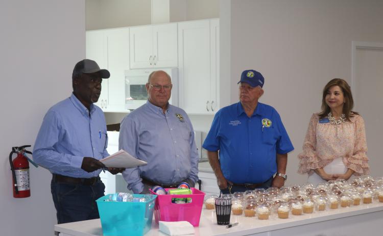 Fort White resident Marvin Brown (from left) details the history of the land on which the new Bethlehem Community Center sits during Tuesday’s ribbon cutting next to Columbia County Commissioners Rocky Ford and Everett Phillips as well as Lake City-Columbia County Chamber of Commerce Member Services Director Missy Hartley. (TONY BRITT/Lake City Reporter)