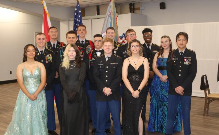Columbia High School JROTC cadets, who are seniors, pose for a photograph after being recognized by other members of the Fighting Tiger Battalion during a military ball on Friday night at American Legion Post 57. (TONY BRITT/Lake City Reporter)