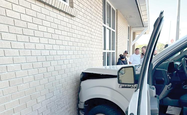 A pickup crashed into the Lake City Public Safety Building on Thursday morning after the driver accidentally hit the accelerator instead of the brake as she pulled into a parking spot. (COURTESY)