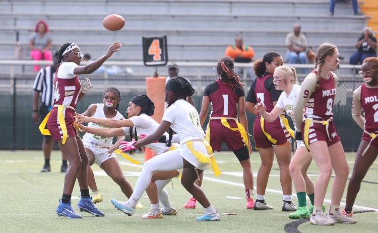 Florida High quarterback Danielle White throws under pressure from the Suwannee defense during the Region 1-1A semifinals on Monday night. (PAUL BUCHANAN/Lake City Reporter)