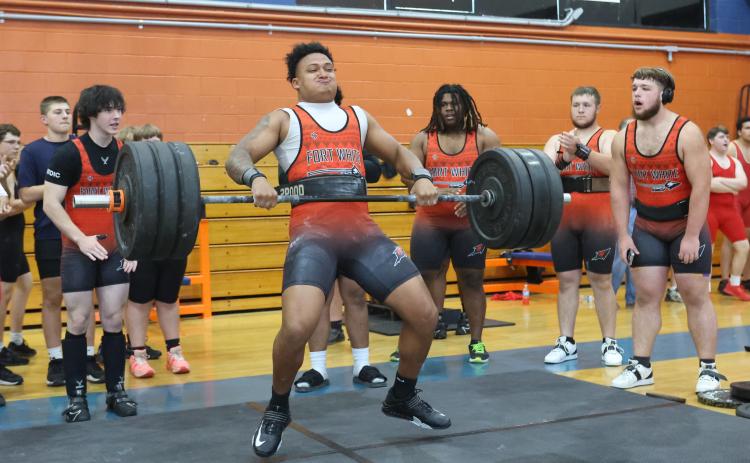 Fort White's Lecosta Byrd brings the bar up during the clean and jerk at the District 6-1A meet on March 28. (PAUL BUCHANAN/Lake City Reporter)