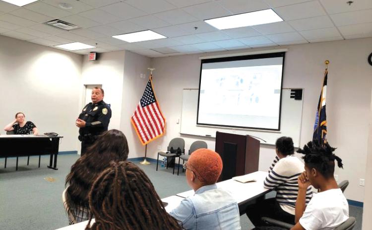 Lake City Police Chief Gerald Butler talks with teens about interviewing during the police department’s Sumer Youth Employment Program in 2019. (COURTESY)