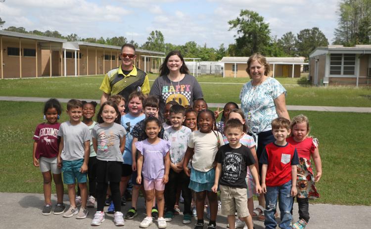 Summers Elementary School VPK paraprofessional Kelsie Rodriguez (back middle) has been named a finalist for the state’s School-Related Employee of the Year award. Rodriguez is pictured with her VPK students as well as Summers Principal Robert Cooper and VPK teacher Karen McDonald. (MORGAN MCMULLEN/Lake City Reporter)