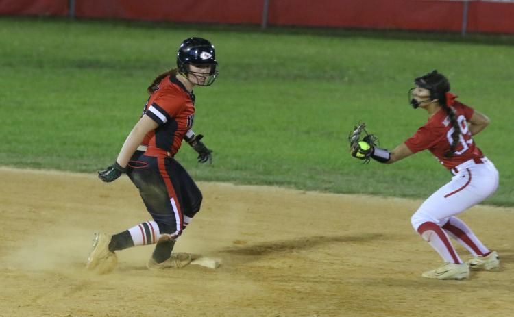 Fort White's Hannah LeBleu slides safely into second base in front of Williston's Grace McDaniel Tuesday night. LeBleu scored three batters later on Morgan Kelly's sac fly. (MORGAN MCMULLEN/Lake City Reporter)