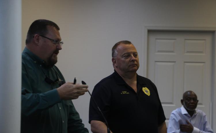 Lake City Police Chief Gerald Butler (right) said any rumors that Officer Marcus Hardison being shot by another law enforcement officer were not true. (MORGAN MCMULLEN/Lake City Reporter)
