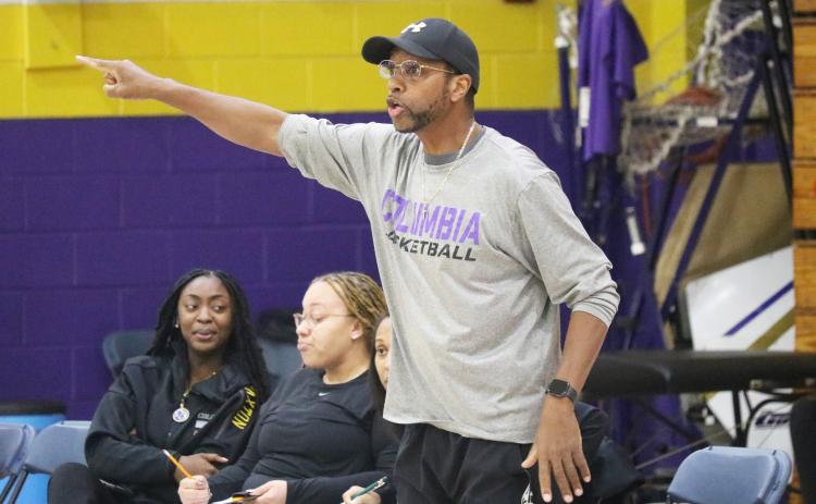 Columbia coach Anthony Perry calls out a play to his team during a game against St. Augustine on Dec. 21, 2023. Perry resigned as the Tigers coach Monday following eight-plus seasons at the helm. (FILE)