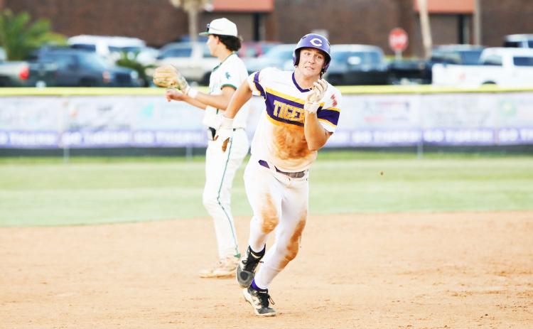 Columbia’s Ayden Phillips races to third base during Friday’s win over Flagler Palm Coast. (BRENT KUYKENDALL/Lake City Reporter)
