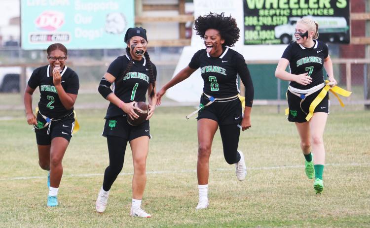 Suwannee defensive back Jessica Tran (1) celebrates with teammates Kayla Frederick-Woods (2), Alaira Handy (8) and Miranda Ramsey (7) after scoring on a pick-6 against Santa Fe during the Region 1-1A quarterfinals on Wednesday. (PAUL BUCHANAN/Lake City Reporter)