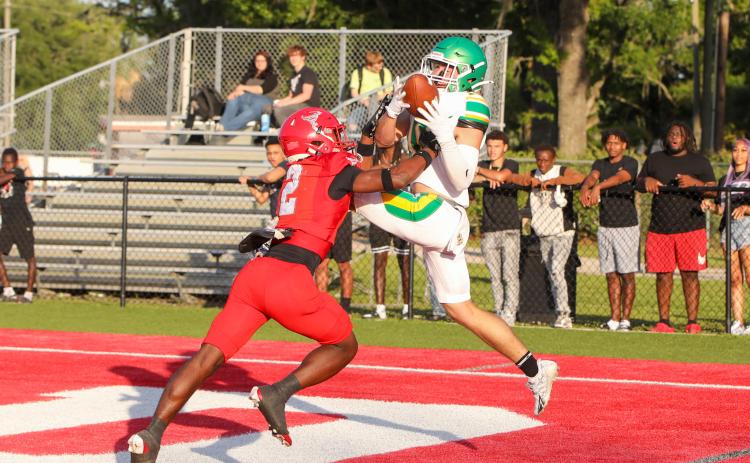Suwannee receiver Koy Frier can't hold on to a catch that's wrestled away by Bradford defensive back Jordan Cason for an interception during the teams' spring game Thursday night. (BRENT KUYKENDALL/Lake City Reporter)