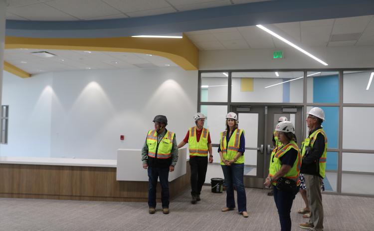 Assistant Superintendent Todd Widergren (right) and Fred Gaylard, the district’s new construction project manager (left), give Half-Cent Sales Tax Advisory Committee members a tour of the new Niblack Elementary School on Wednesday. (TONY BRITT/Lake City Reporter)