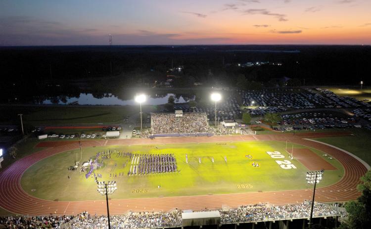 The sun sets Friday night over Tiger Stadium during Columbia High’s commencement ceremony for the Class of 2025. (RAY CARPENTER/Lake City Reporter)