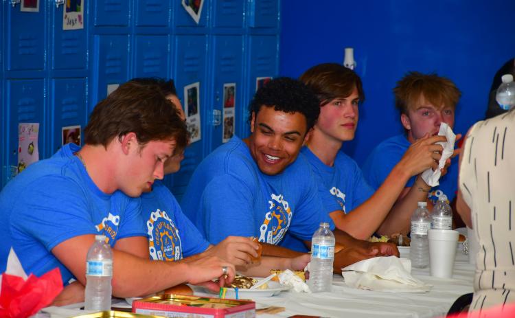 Members of The Ability Experience’s Gear Up Florida event enjoy dinner at The Arc North Florida last week. The group of 30 cyclists and six crew members stopped off in Live Oak on Florida on their biking event across the state. (ROB WOLFE/Lake City Reporter)
