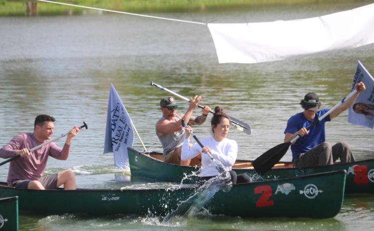 Participants take off in a race during last year’s inaugural DeSoto Derby canoe race, sponsored by the Elks Lodge #893. This year’s race has been postponed to June 14. (FILE)