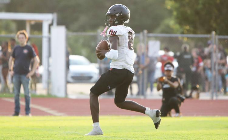 Fort White quarterback Jayden Jackson drops back to pass against Columbia in their spring game on May 17. (BRENT KUYKENDALL/Lake City Reporter)