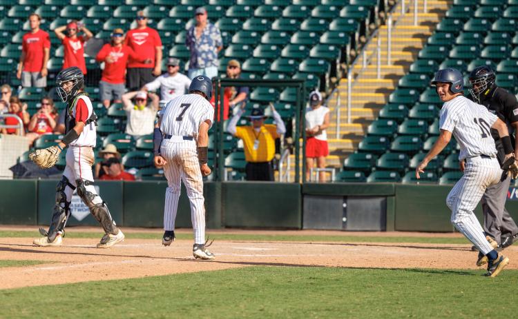 Holmes County center fielder Colby Powell (7) scores the game-winning run with two outs in the bottom of the seventh inning to defeat Lafayette 2-1 in the Class Rural state championship game on Thursday. (JACK HOWDESHELL/Lake City Reporter)
