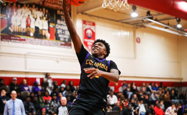 Columbia guard Shaheed White rises for a layup against Santa Fe this past season. (BRENT KUYKENDALL/Lake City Reporter)