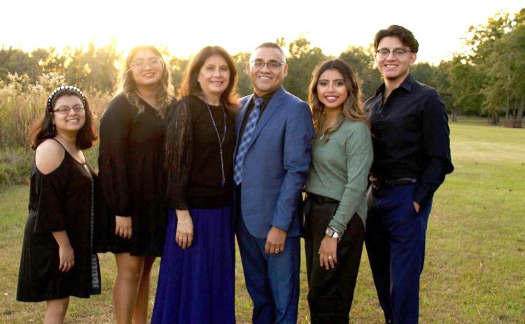 Maria Isidro (third from right), pictured with her husband Josafat and their four children, was detained last week by immigration officials during a meeting in Tallahassee. Her family said she was dropped off at the Mexican border Wednesday night. (COURTESY)