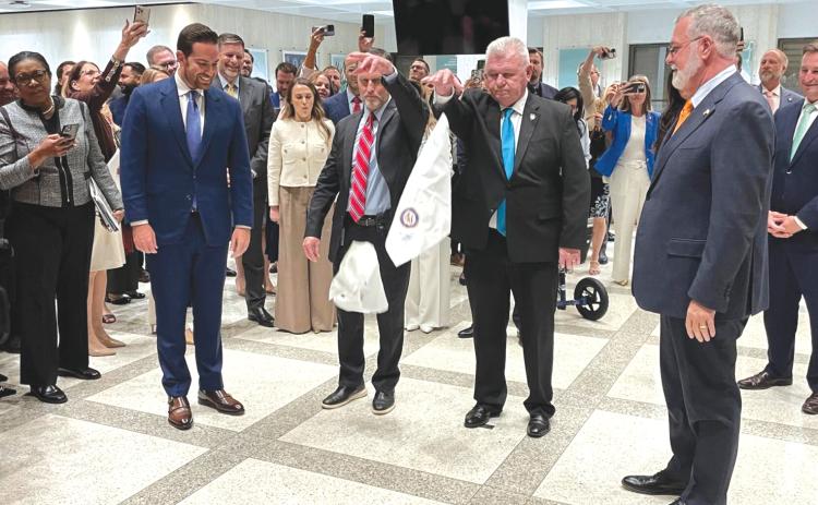 House Speaker Daniel Perez (left) and Senate President Ben Albritton (right) took part in a traditional hanky-drop ceremony marking the end of the legislative  session. (NEWS SERVICE OF FLORIDA)