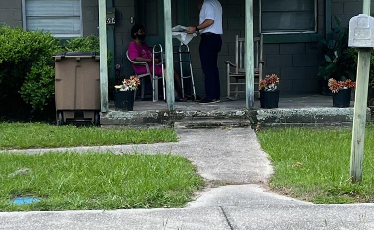 Lake City Assistant Fire Chief Ret Tompkins stops at a residence Tuesday to help install smoke detectors and provide disaster preparedness information. (COURTESY LAKE CITY FIRE DEPARTMENT)