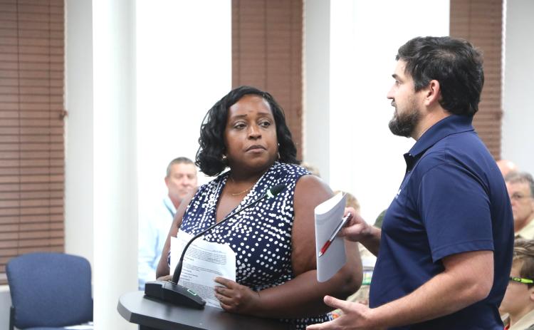 Shannon Williams (left) and Michael Klink update the Lake City Council on a Hazard Mitigation Grant meant for restoration at Gwen Lake during Monday’s meeting. (MORGAN MCMULLEN/Lake City Reporter)