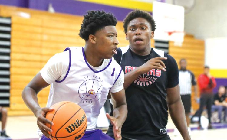 Columbia guard Shaheed White makes a move in the paint Thursday against Fort White in the two teams’ summer league finale. (BRENT KUYKENDALL/Lake City Reporter)