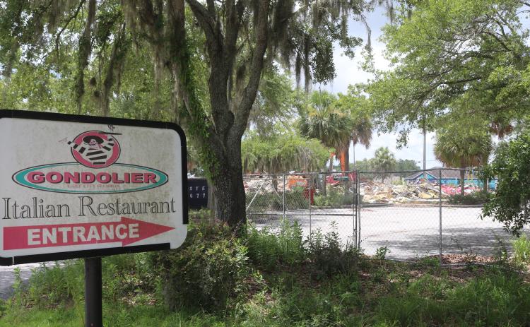 The Gondolier Italian Restaurant and Pizza building was demolished Tuesday afternoon, nearly five years after the restaurant closed in September 2020. (TONY BRITT/Lake City Reporter)