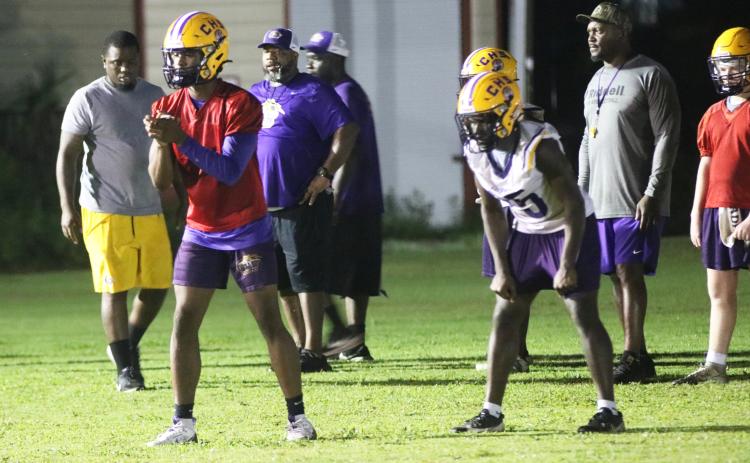 Columbia quarterback Xavier Collins (left) gets set to take a snap alongside running back Jerome Horne during Tuesday's practice. (JORDAN KROEGER/Lake City Reporter)