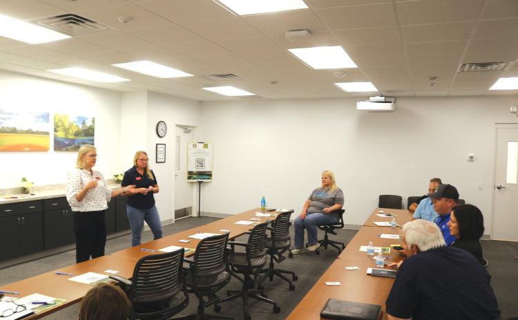 Land planners Kristin Reed (left) and Blair Knighting get feedback and information from local business and development representatives during a meeting on Friday as the county looks to upgrade its land development regulations. (TONY BRITT/Lake City Reporter)