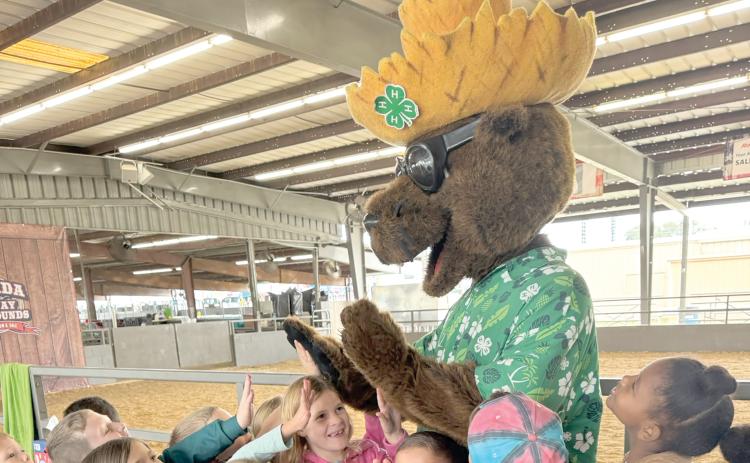 Bellamy Beaver gives high-five’s to a group of excited children. Bellamy’s Big Field Day with Columbia County students and the Columbia County Sports Commission is set for February. (COURTESY COLUMBIA COUNTY 4-H)