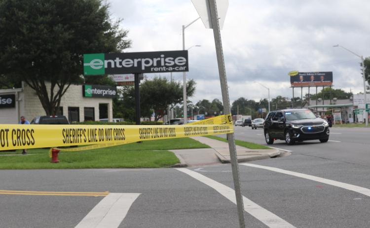 Law enforcement officials converged at the Enterprise Rent-A-Car facility on U.S. Highway 90 after an employee noticed a strange device in a car during vehicle inspections. The device was deemed not dangerous by the Alachua County Sheriff’s Office Bomb Squad. (JAMIE WACHTER/Lake City Reporter)