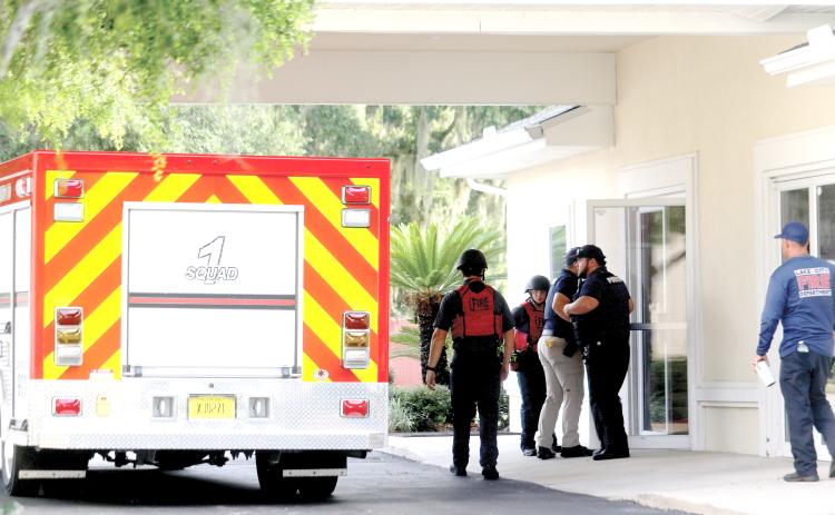 Lake City firefighters and police officers enter the Southside Baptist Church on Tuesday for an active assailant training session. (TONY BRITT/Lake City Reporter)