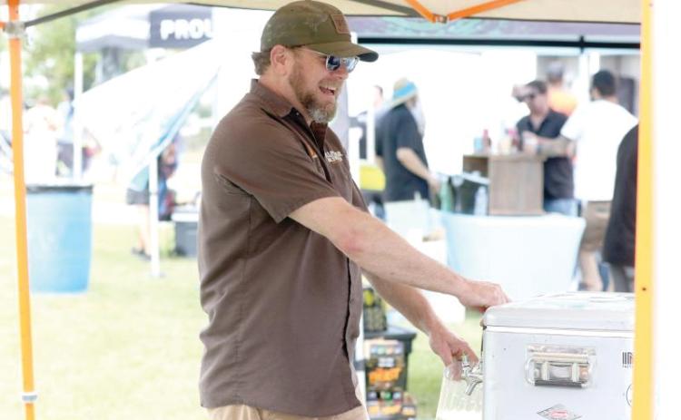 Halpatter Brewing Company’s Chris Candler prepares a beverage during the 2024 Gateway City Craft Beer & Wine Festival. (FILE)