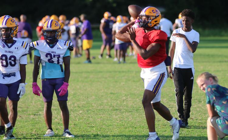 Columbia quarterback Xavier Collins throws a pass during practice on Tuesday. (JORDAN KROEGER/Lake City Reporter)