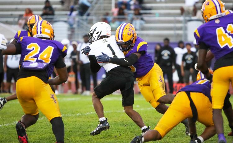 Columbia defensive back Von Lane tackles Oakleaf running back Mike Conner during Friday’s Preseason Classic. (BRENT KUYKENDALL/Lake City Reporter)