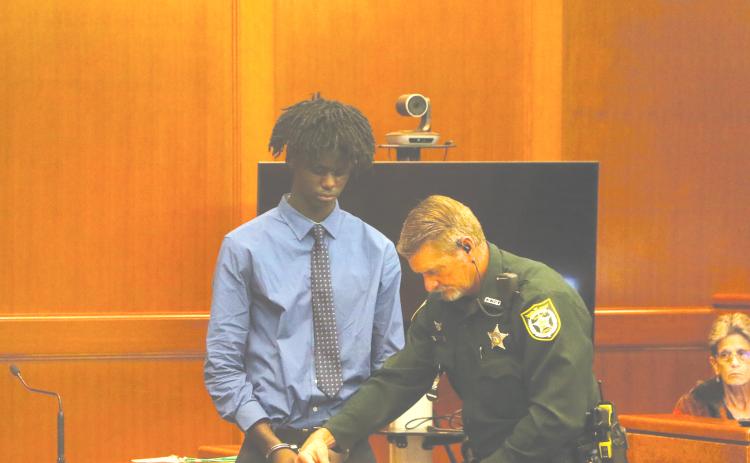 Jayden Burch is fingerprinted after being found guilty of murder and attempted murder on Wednesday in a 2023 shooting that killed 12-year-old Mariah Smith. (MORGAN MCMULLEN/Lake City Reporter)