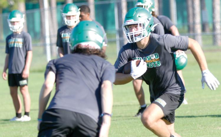 Suwannee receiver Koy Frier runs up the field after a catch during practice on July 28. (JAMIE WACHTER/Lake City Reporter)