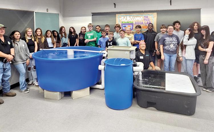 Suwannee Middle School staff and students are pictured after the aquaponics lab was installed for Megan Collins’ homesteading class. (COURTESY)