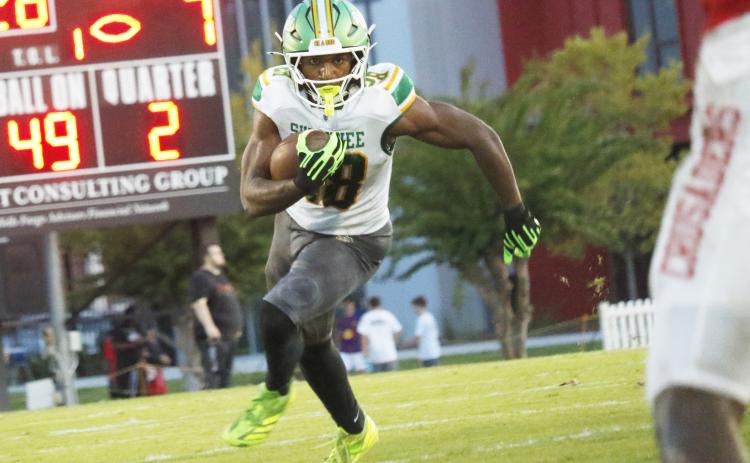 Suwannee running back Lou Jack Smith eyes a hole against Bishop Kenny in the Preseason Classic on Aug. 15. (JAMIE WACHTER/Lake City Reporter)