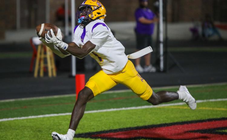 Columbia receiver Kyren Caldwell hauls in a touchdown pass Friday night against Hillsborough. Caldwell had three scoring catches on the night. (BRENT KUYKENDALL/Lake City Reporter)