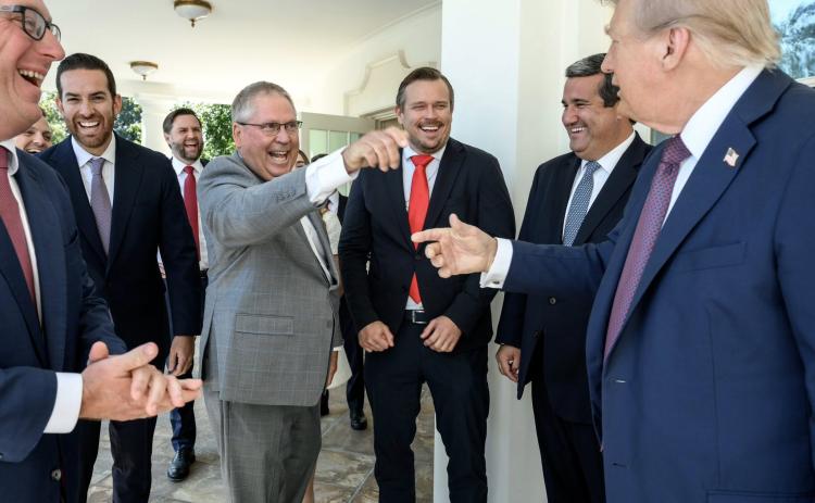 President Donald Trump (right) points at Rep. Chuck Brannan (middle) and thanked him Thursday for sponsoring the bill to name a portion of Southern Boulevard in Palm Beach County after him. Also visiting the West Wing on Thursday from the Florida House of Representatives were Lawrence McClure (from left), House Speaker Daniel Perez, James Buchanan and Tyler Sirois. (COURTESY CHUCK BRANNAN)