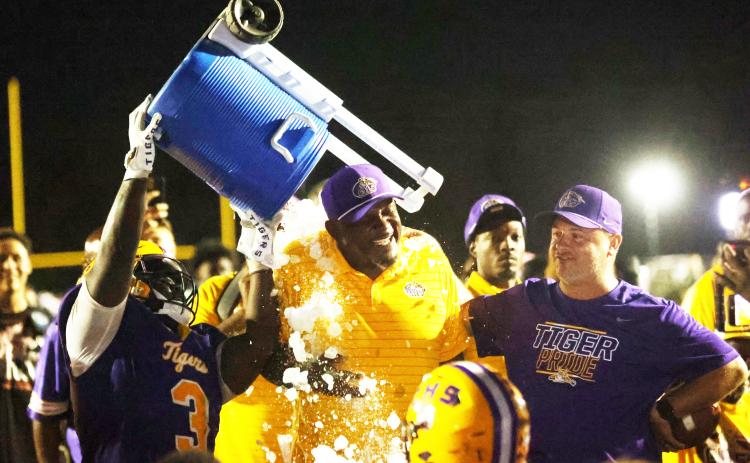 Columbia defensive lineman Terry Henry douses head coach Brian Allen with water after Allen recorded his 100th win. (PAUL BUCHANAN/Lake City Reporter)