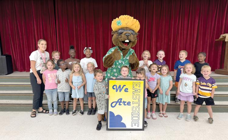 Bellamy Beaver hangs out with students at Eastside Elementary School during his visit Friday to talk about water conservation. (COURTESY)
