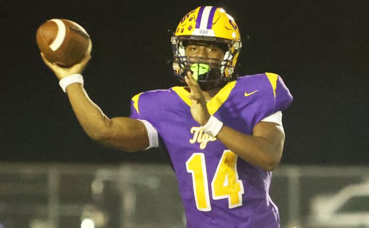 Columbia quarterback Xavier Collins throws a pass against Trinity Christian last Friday. (PAUL BUCHANAN/Lake City Reporter)