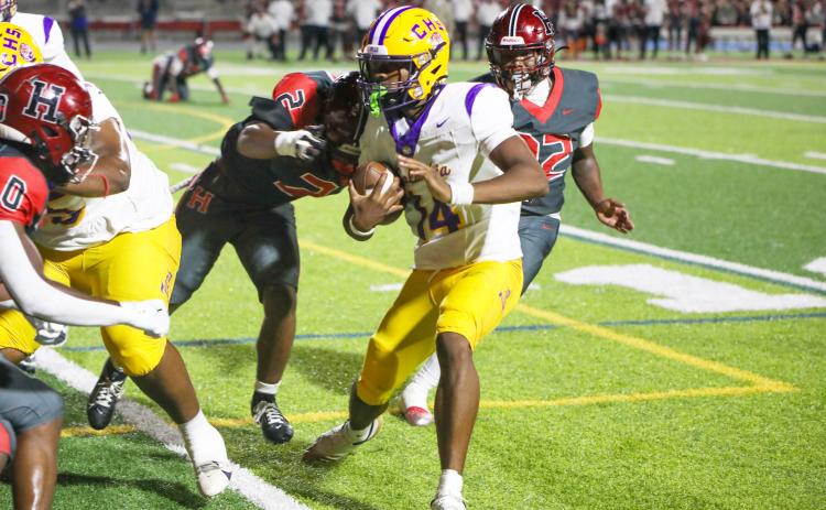 Columbia quarterback Xavier Collins looks for running room during last Friday’s win over Hillsborough. (BRENT KUYKENDALL/Lake City Reporter)