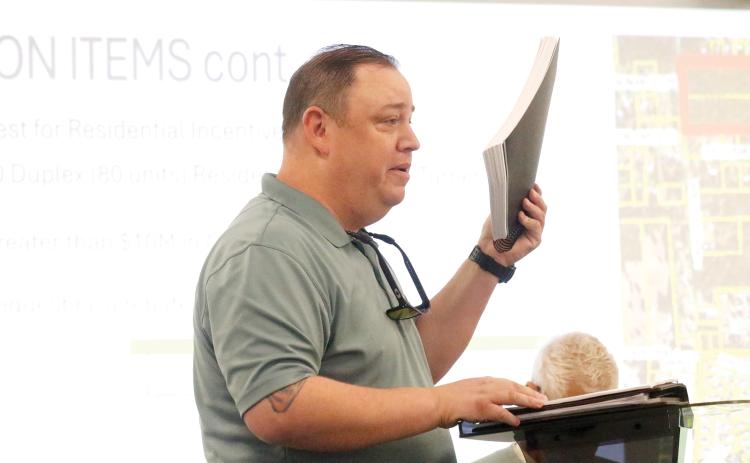 Dylan Adams with the Haymar Group talks about the 80-door duplex project on Turner Avenue with the Columbia County Economic Development Advisory Board on Thursday. (JAMIE WACHTER/Lake City Reporter)