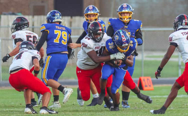 Fort White linebacker Dreyson Lally makes a tackle against Fernandina Beach last Friday. (ASHLEY CHANDLER/Fernandina Beach News-Leader)