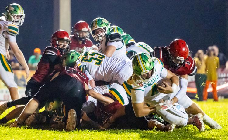 Suwannee quarterback Thomas Sikes scores on a 1-yard touchdown run against Lafayette last Friday. (JACK HOWDESHELL/Lake City Reporter)