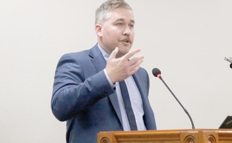 Matthew Ori, a senior consultant with Raftelis, talks to the North Florida Water Utilities Authority board on Wednesday about the status of the rate study being performed by the group. (JAMIE WACHTER/Lake City Reporter)